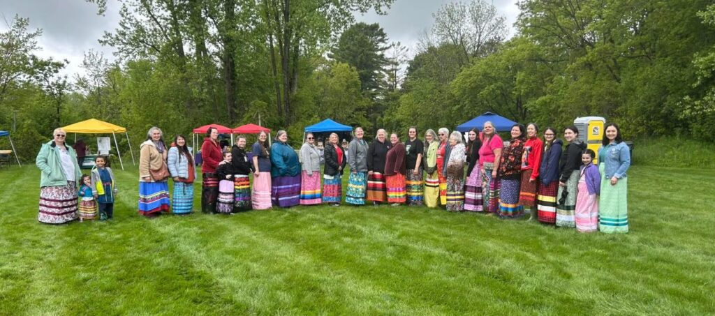 Women wearing ribbon skirts